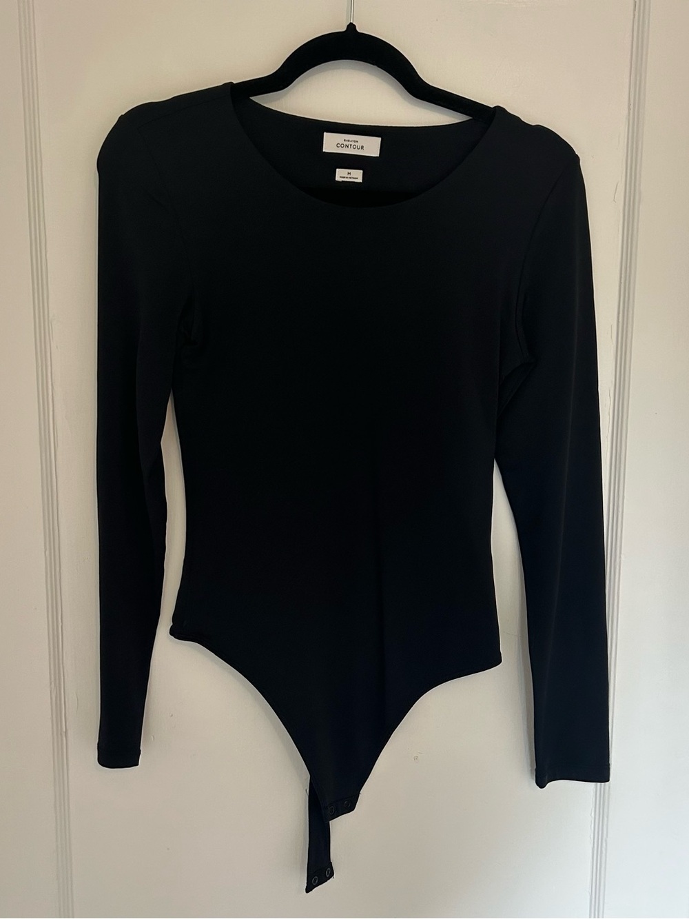 Babaton Black Long-Sleeve One-Piece Bodysuit